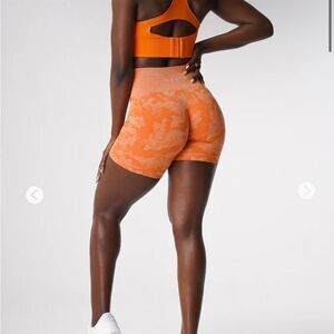 NVGTN Orange Camo Seamless Shorts. Size L NWT